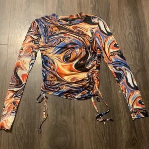 Long sleeve mesh top ! Very trendy and can UPGRADE and outfit.